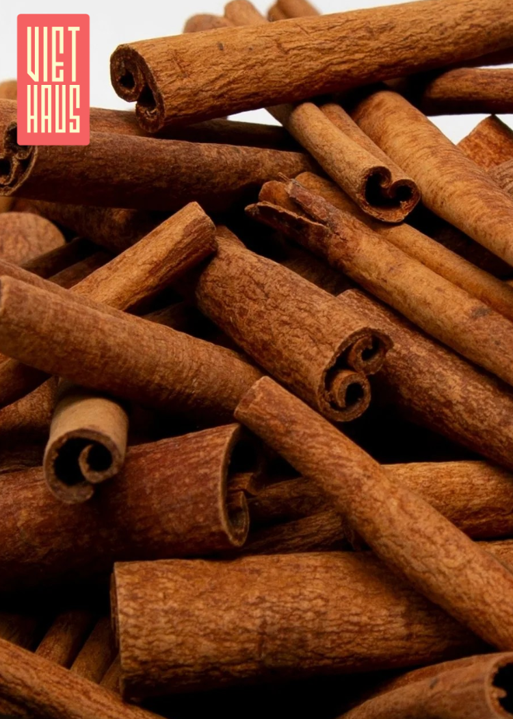 Stack of cinnamon sticks with 'Viet Haus' logo in the corner