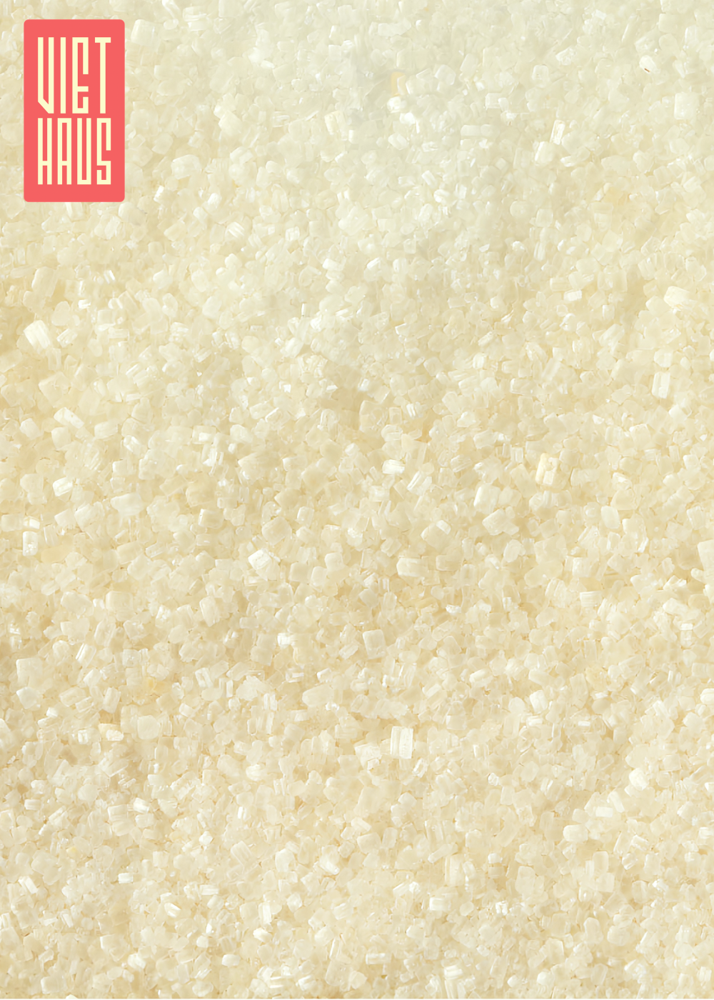 A detailed close-up shot of organic cane sugar crystals, showcasing their natural, light golden color and uniform texture.