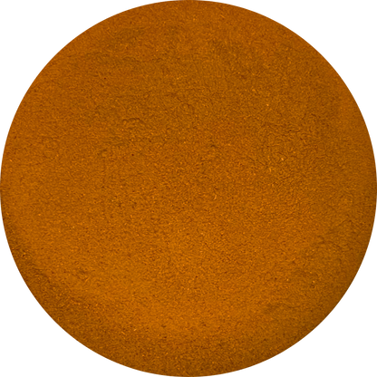 Top view of a circular pile of organic orange-brown spice powder
