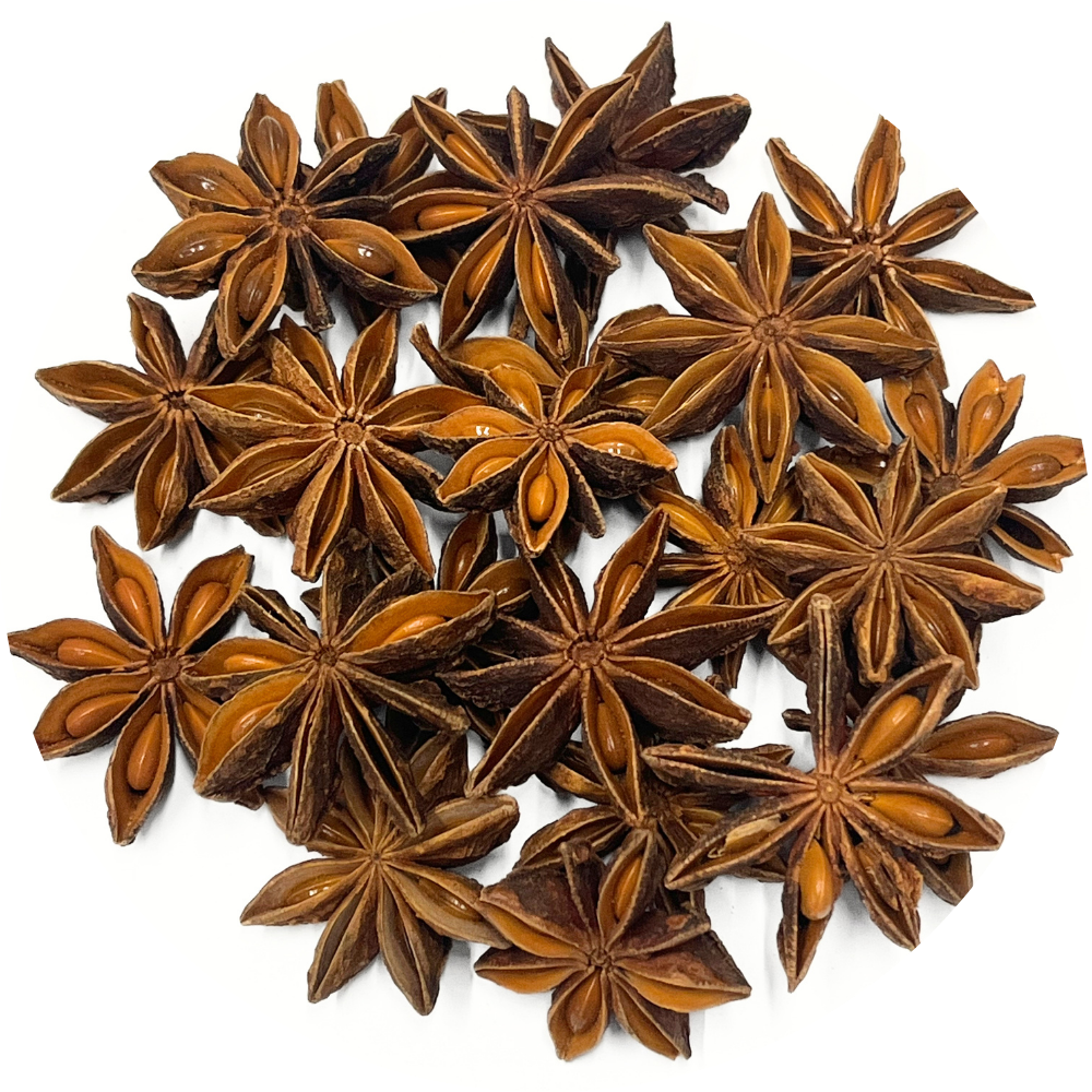 A pile of organic star anise pods on a white background