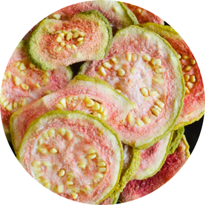 Dried organic guava slices showing the natural green skin and vibrant pink interior flesh