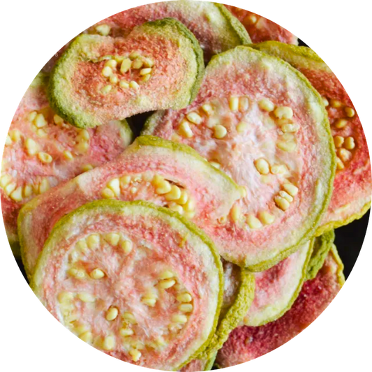 Dried organic guava slices showing the natural green skin and vibrant pink interior flesh
