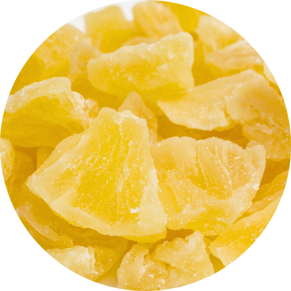 Macro circular view of golden, translucent dried pineapple chunks from Ninh Thuan, Vietnam, showcasing a crystalline texture and rich natural sweetness