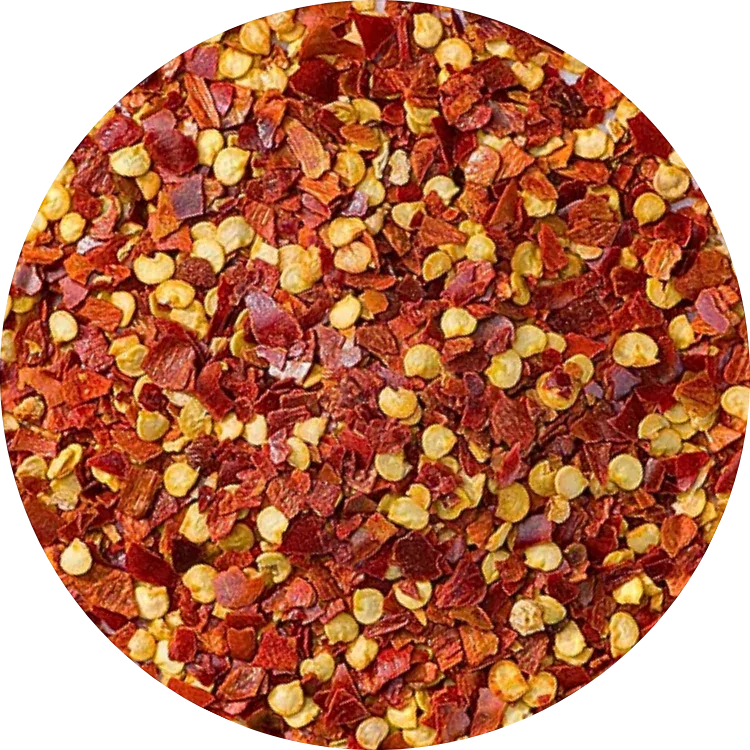 organic red chili flakes showing a mix of vibrant red skin pieces and natural yellow seeds
