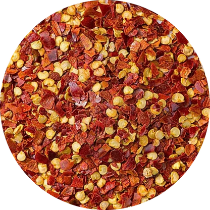 organic red chili flakes showing a mix of vibrant red skin pieces and natural yellow seeds