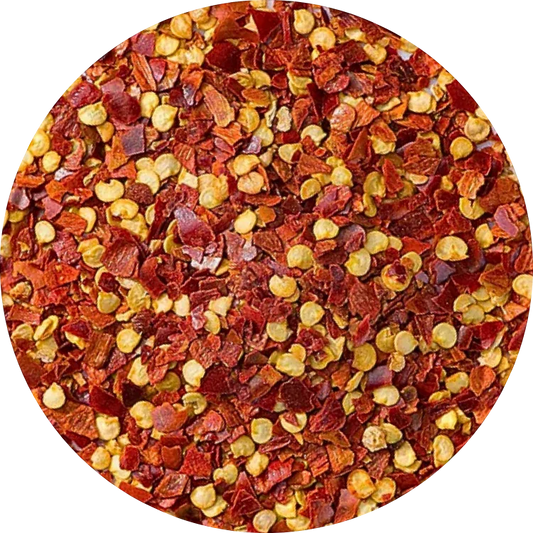 organic red chili flakes showing a mix of vibrant red skin pieces and natural yellow seeds