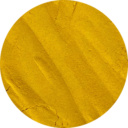 A round mound of organic turmeric powder showing its deep yellow pigment and high curcumin content