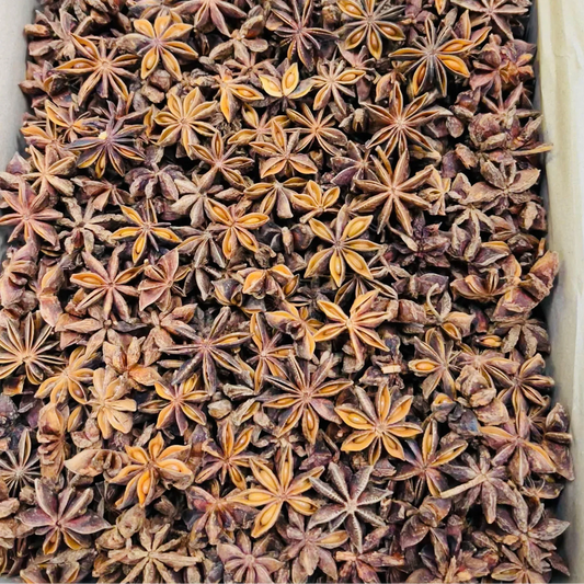 Close-up of whole organic star anise pods in a container